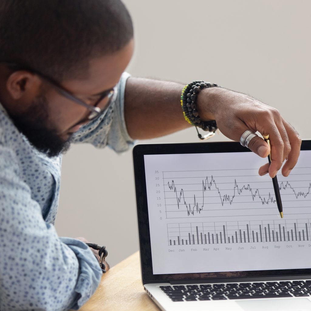 a man points at a time graph with a pen